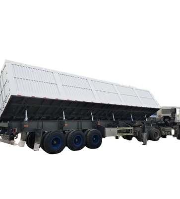CIMC Tri άξονας Side Tipper 70 τόνους επιτρέπει τα εμπορεύματα να ξεφορτωθούν από την πλευρά μεταφοράς υλικών κατασκευής ντάμπινγκ ημιτελόνι